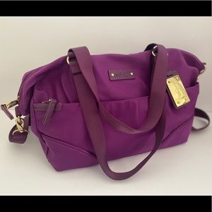 Purple Kipling Bag with Gold accents.